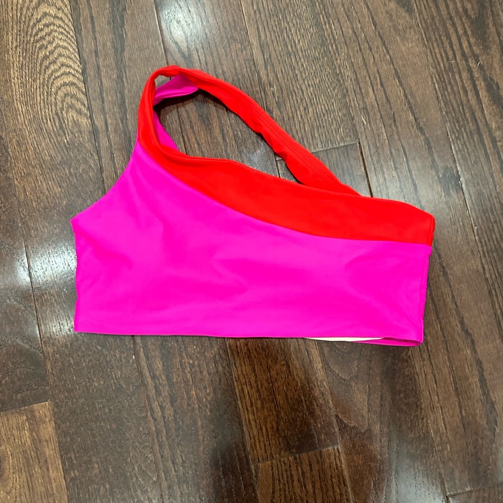 Pink and red one shoulder summersalt swimsuit top
